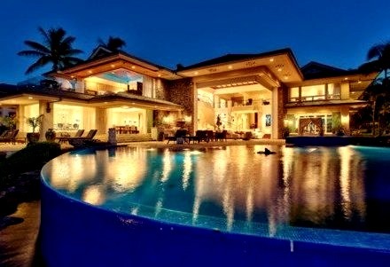 Night time Mansion and Pool Lit Up